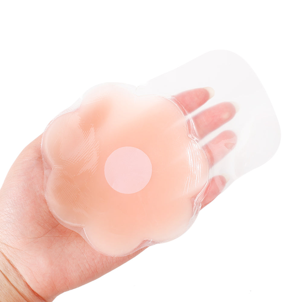 Adhesive nipple covers